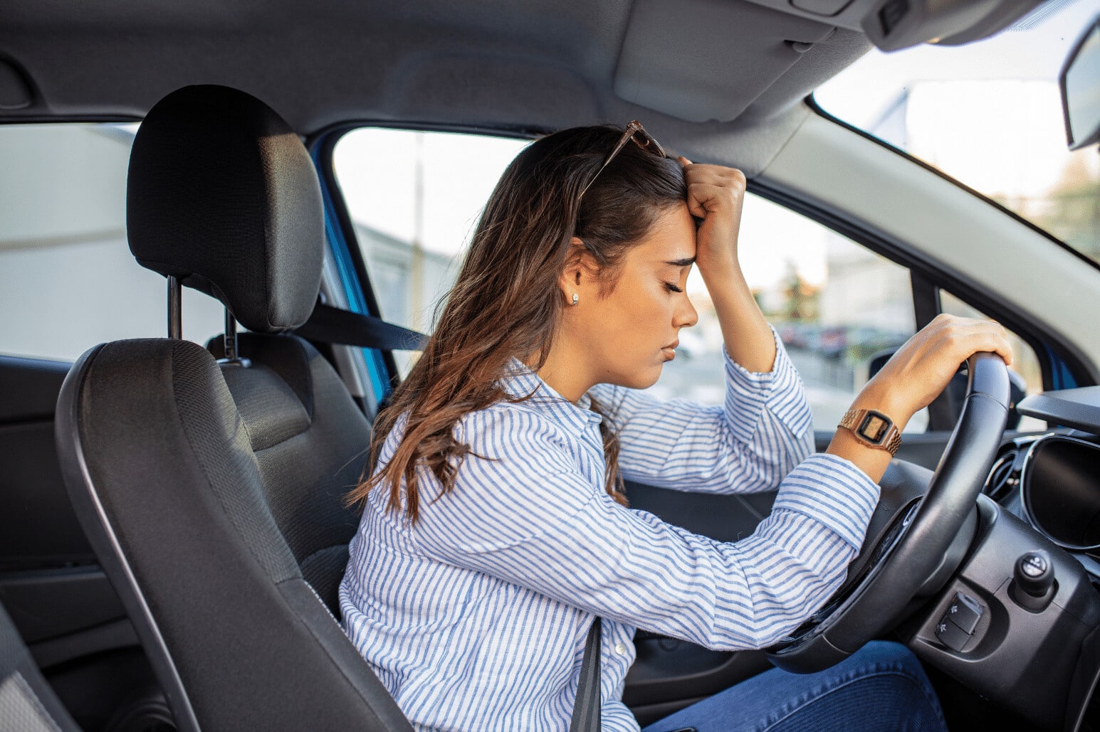 Sometimes it feels like driving anxiety is ruining my life. Image of a woman experiencing driving anxiety.